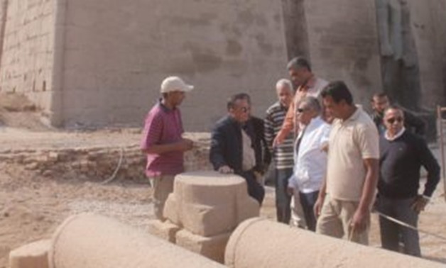 The secretary general of the Supreme Council of Antiquities Mostafa Waziri visited on Saturday the site where the parts of king Ramesses II statue are being assembled  to return  the statue to its original place at the facade of the temple of Luxor - Egyp
