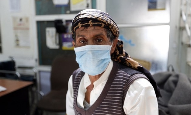 A Yemeni man suspected of being infected with cholera receives treatment at a hospital in Sanaa on 12 May (AFP)