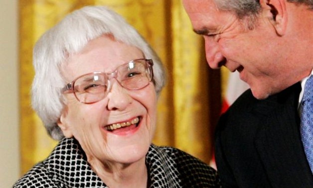 FILE PHOTO: U.S. President George W. Bush (R) before awarding the Presidential Medal of Freedom to American novelist Harper Lee (L) in the East Room of the White House, in this November 5, 2007. REUTERS/Larry Downing.