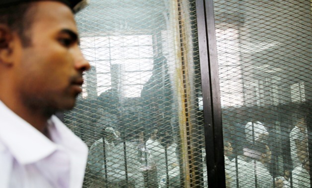 Defendants inside court deck in Cairo - Reuters 