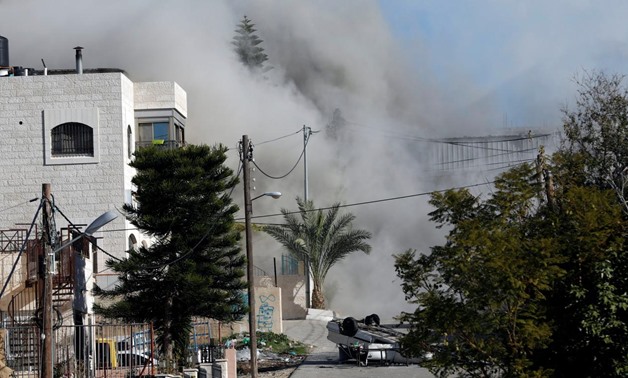 Smoke rises as Israeli forces blow up the house of Palestinian family Abu Humaid, in al-Amari refugee camp in Ramallah, in the Israeli-occupied West Bank December 15, 2018. REUTERS/Mohamad Torokman