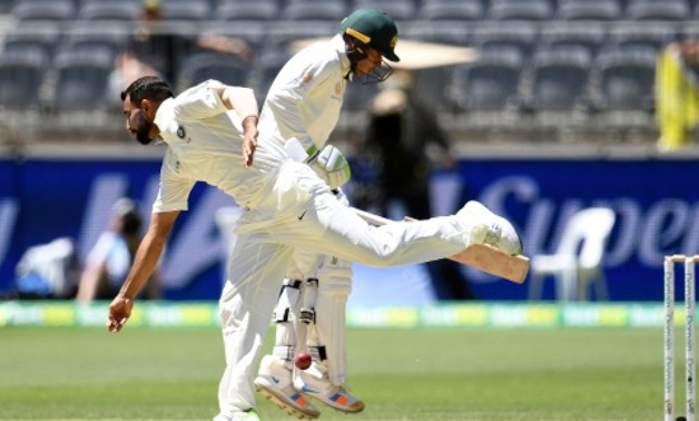 India's Mohammed Shami attempts to field as Australia's batsman Usman Khawaja runs back to the crease India's Mohammed Shami attempts to field as Australia's batsman Usman Khawaja runs back to the crease AFP

