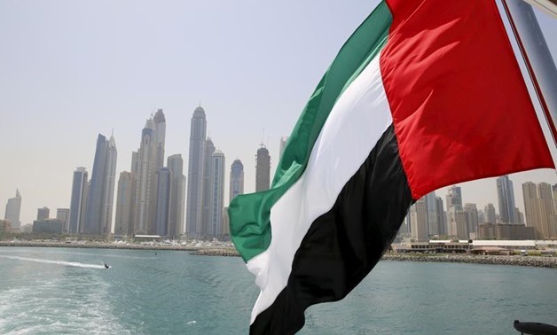 UAE flag flies over a boat at Dubai Marina, Dubai, United Arab Emirates May 22, 2015. REUTERS/Ahmed Jadallah