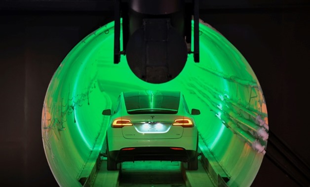 Elon Musk unveiled a sample tunnel, part of a vision for an underground network that cars can be lowered into then propelled along tracks at speeds up to 150 mph (241 kmh)
