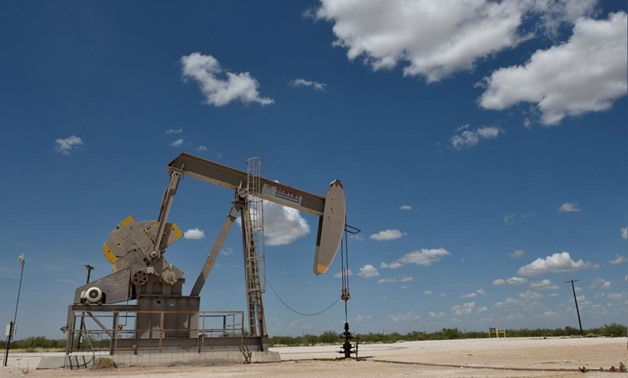 FILE PHOTO: A pump jack operates in the Permian Basin oil production area near Wink, Texas U.S. August 22, 2018. Picture taken August 22, 2018. REUTERS/Nick Oxford
