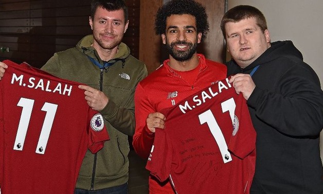 Salah with Liverpool's supporters - Liverpool official website

