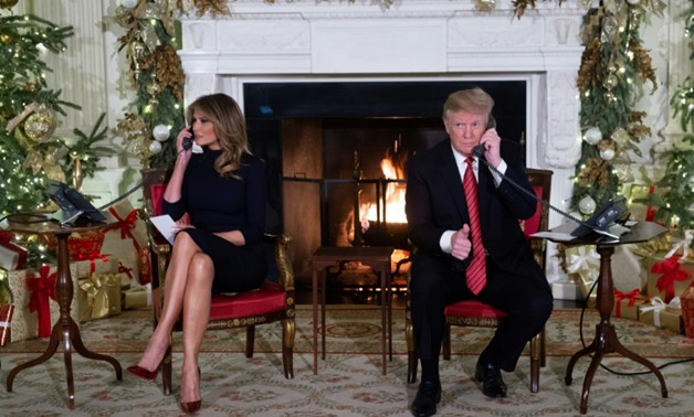 On Christmas Eve, US President Donald Trump (R) asked a seven-year-old: "Are you still a believer in Santa Claus?"
