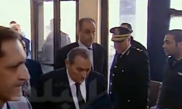 Former president Hosni Mubarak entering the court - Still image from a live broadcast