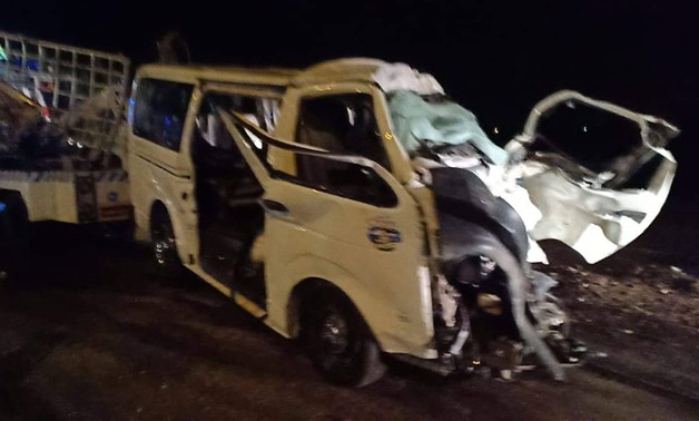 A microbus collided with a truck pulling a trailer leaving 8 deaths
