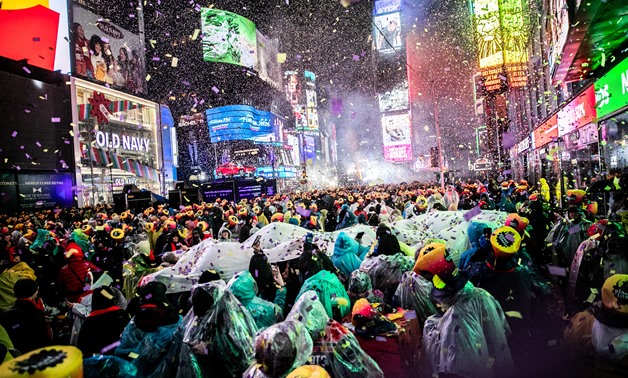 Revelers celebrate New Year's Eve in Times Square in the Manhattan borough of New York, U.S., December 31, 2018. REUTERS/Jeenah Moon