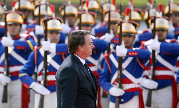 Brazil's new President Jair Bolsonaro reviews the troops after the swearing-in ceremony as he leaves Brazil's National Congress, in Brasilia, Brazil January 1, 2019. REUTERS/Pilar Olivares
