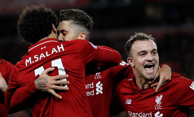Soccer Football - Premier League - Liverpool v Arsenal - Anfield, Liverpool, Britain - December 29, 2018 Liverpool's Roberto Firmino celebrates scoring their fifth goal with XherdanShaqiri and Mohamed Salah REUTERS/Phil Noble