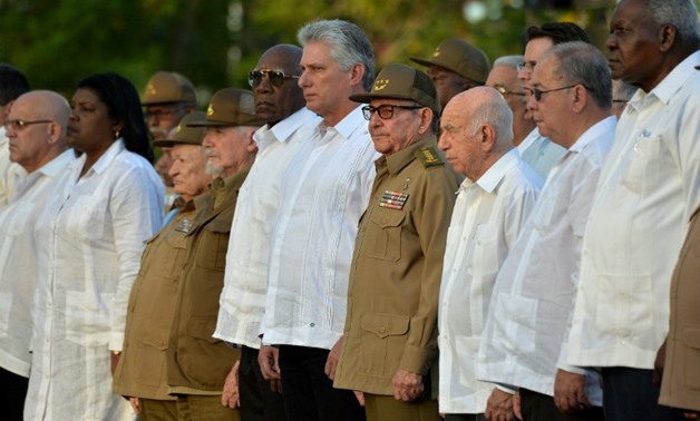The First Secretary of the Cuban Communist Party, Raul Castro (4th-R), and President Miguel Diaz-Canel (5th-R) take part in the celebration of the 60th anniversary of the Cuban revolution in Santiago de Cuba
