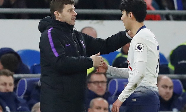 Soccer Football - Premier League - Cardiff City v Tottenham Hotspur - Cardiff City Stadium, Cardiff, Britain - January 1, 2019 Tottenham's Son Heung-min with manager Mauricio Pochettino as he is substituted Action Images via Reuters/Matthew Childs EDITORI