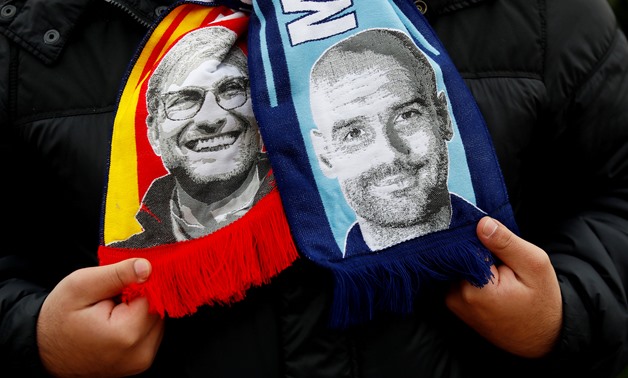 FILE PHOTO: Soccer Football - Champions League Quarter Final Second Leg - Manchester City vs Liverpool - Etihad Stadium, Manchester, Britain - April 10, 2018 General view of a scarf of Liverpool manager Juergen Klopp and Manchester City manager Pep Guardi