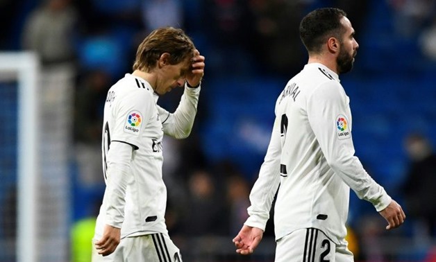 Tough to take: Real Madrid's Luka Modric and Dani Carvajal leave the pitch-  AFP / GABRIEL BOUYS
