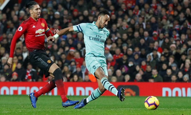 FILE PHOTO: Soccer Football - Premier League - Manchester United v Arsenal - Old Trafford, Manchester, Britain - December 5, 2018 Arsenal's Pierre-Emerick Aubameyang shoots at goal Action Images via Reuters/Carl Recine
