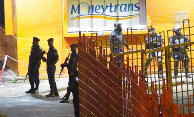 Congolese riot police take position around the electoral commission building at night in Kinshasa, Congo, Tuesday Jan. 8, 2019. - AP Photo