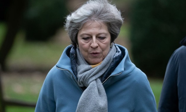 Daniel Leal-Olivas, AFP | Theresa May leaves after attending a church service, near her Maidenhead constituency, west of London on January 13, 2019.
