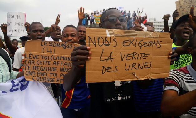 File- Supporters of Martin Fayulu, chant slogans as he delivers his appeal contesting the CENI results of the presidential election at the constitutional court in Kinshasa- Reuters