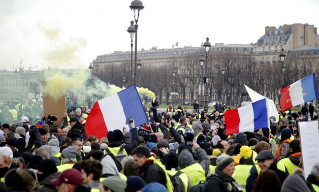 Protesters wearing yellow vests take part in a demonstration by the "yellow vests" movement, in Paris, France, January 19, 2019. REUTERS/Charles Platiau
