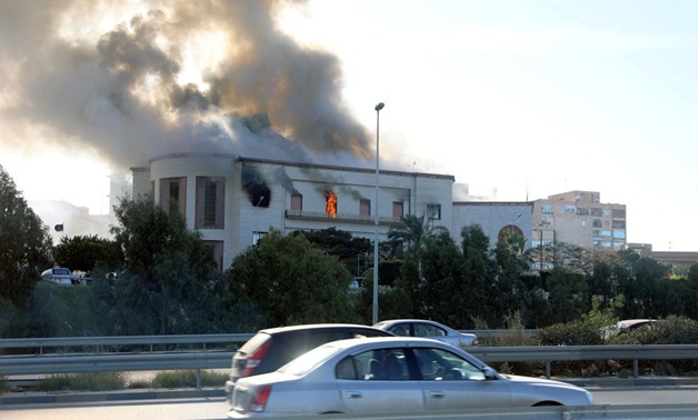 FILE PHOTO: Smoke rises from the site of the headquarters of Libya's foreign ministry after suicide attackers hit in Tripoli, Libya December 25, 2018.

