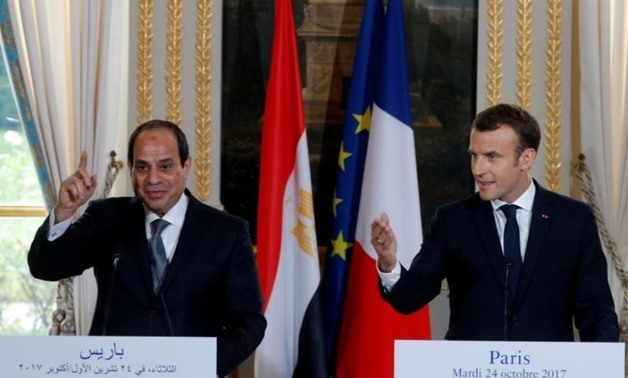 FILE- French President Emmanuel Macron and Egyptian President Abdel Fattah al-Sisi attending a news conference
