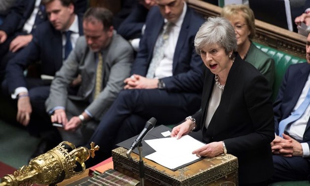 Prime Minister Theresa May talks about Brexit 'plan B' in Parliament, in London, Britain, January 29, 2019. Text in documents removed at source. UK Parliament/Jessica Taylor/Handout via REUTERS
