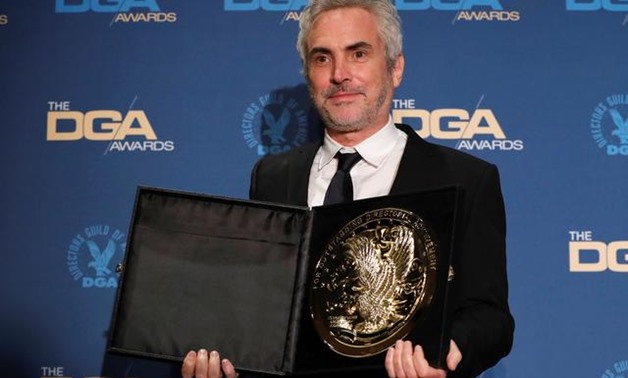 Alfonso Cuaron, director of "Roma" poses with his medallion after winning the Feature Film category at the Directors Guild Awards in Los Angeles, California, U.S. February 2, 2019. REUTERS/Mario Anzuoni.