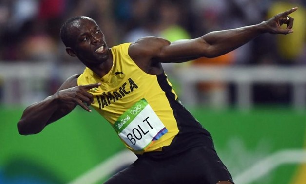 Usain Bolt (JAM) of Jamaica celebrates after winning gold REUTERS/Dylan Martinez
