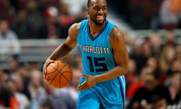Mar 23, 2015; Chicago, IL, USA; Charlotte Hornets guard Kemba Walker (15) looks to pass the ball against the Chicago Bulls during the first half of their NBA game at United Center. Mandatory Credit: Kamil Krzaczynski-USA TODAY Sports