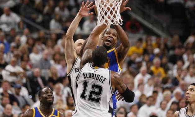 May 20, 2017; San Antonio, TX, USA; Golden State Warriors small forward Kevin Durant (35) is fouled while shooting by San Antonio Spurs shooting guard Manu Ginobili (behind) during the second half in game three of the Western conference finals of the NBA 