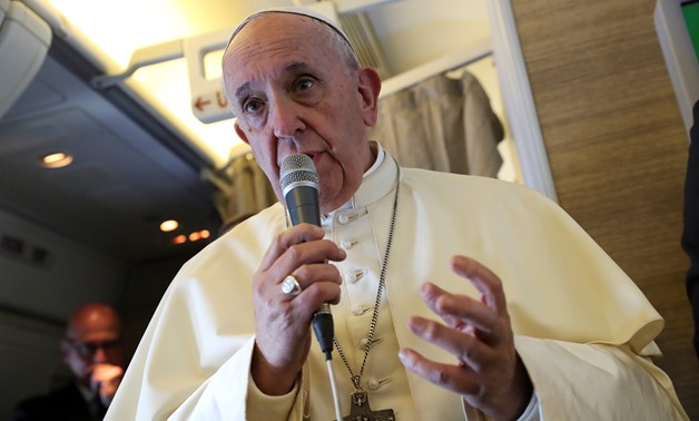 Pope Francis speaks to reporters aboard a plane on the way to Abu Dhabi February 3, 2019. REUTERS/Tony Gentile/Pool
