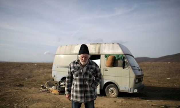Former Dutch boxer Rudi Lubbers stands in front of the van where he and his partner were living for the last eight months, near the village of Kosharitsa, Bulgaria, February 3, 2019. REUTERS/Stoyan Nenov
