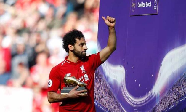 Liverpool's Mohamed Salah celebrates with the Golden Boot after the match Action Images via Reuters/Carl Recine