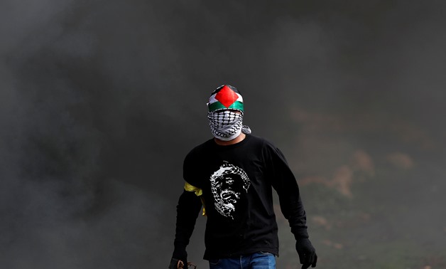 A Palestinian demonstrator is seen during clashes with Israeli forces at a protest in al-Mughayer village near Ramallah, in the Israeli-occupied West Bank, February 1, 2019. REUTERS/Mohamad Torokman
