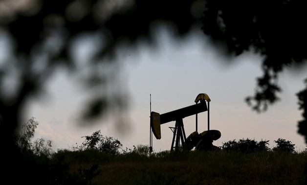 FILE PHOTO: An oil pump jack can be seen in Cisco, Texas, August 23, 2015. Mike Stone/File Photo - REUTERS