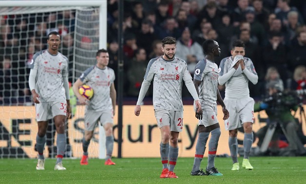 Soccer Football - Premier League - West Ham United v Liverpool - London Stadium, London, Britain - February 4, 2019 Liverpool's Adam Lallana, James Milner and team mates react after conceding their first goal scored by West Ham's Michail Antonio REUTERS/D