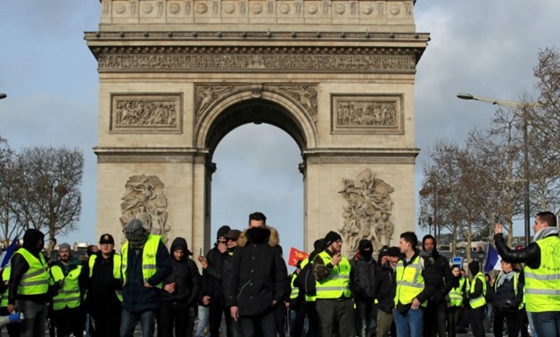 Gonzalo Fuentes, Reuters | Protesters wearing yellow vests take part in a demonstration in Paris on February 9.

