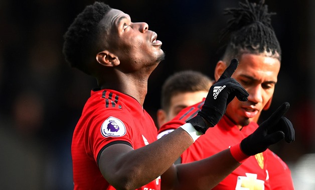 Soccer Football - Premier League - Fulham v Manchester United - Craven Cottage, London, Britain - Febraury 9, 2019 Manchester United's Paul Pogba celebrates scoring their third goal with Chris Smalling REUTERS/Dylan Martinez