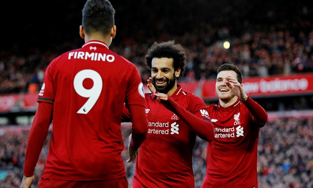 Soccer Football - Premier League - Liverpool v AFC Bournemouth - Anfield, Liverpool, Britain - February 9, 2019 Liverpool's Mohamed Salah celebrates scoring their third goal with Roberto Firmino and Andrew Robertson REUTERS/Phil Noble EDITORIAL USE ONLY. 