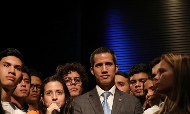 Venezuelan opposition leader Juan Guaido, who many nations have recognized as the country's rightful interim ruler, is seen with students in Caracas, Venezuela February 11, 2019. REUTERS/Andres Martinez CasaresREUTERS

