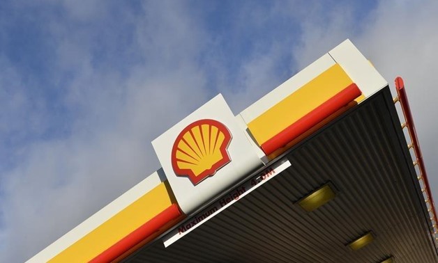 Shell branding is seen at a petrol station in west London, January 29, 2015. REUTERS/Toby Melville