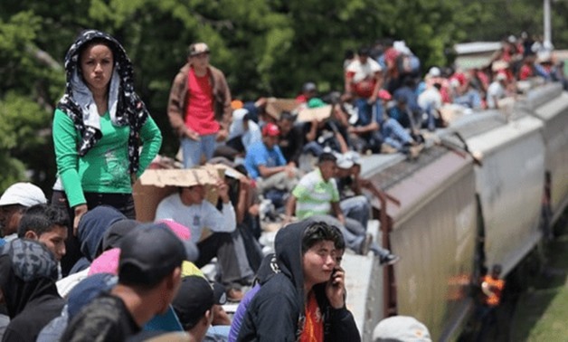 In Pics: Migrants camp on bridge between Guatemala and Mexico as U.S. pressure mounts - Egypt Today
