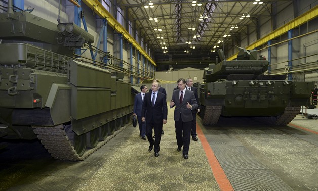 FILE PHOTO: Russian President Vladimir Putin and head of Ural Transport Machine Building Design Bureau Terlikov visit Uralvagonzavod factory in Nizhny Tagil- Reuters