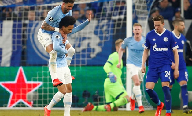 Soccer Football - Champions League - Round of 16 First Leg - Schalke 04 v Manchester City - Veltins-Arena, Gelsenkirchen, Germany - February 20, 2019 Manchester City's Leroy Sane celebrates scoring their second goal with Kyle Walker REUTERS/Wolfgang Ratta