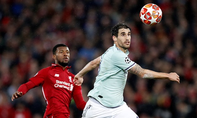 Soccer Football - Champions League - Round of 16 First Leg - Liverpool v Bayern Munich - Anfield, Liverpool, Britain - February 19, 2019 Bayern Munich's Javi Martinez in action with Liverpool's Georginio Wijnaldum Action Images via Reuters/Carl Recine
