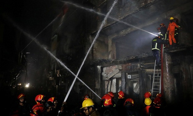 Firefighters work at the scene of a fire that broke out at a chemical warehouse in Dhaka, Bangladesh February 21, 2019. REUTERS/Mohammad Ponir Hossain