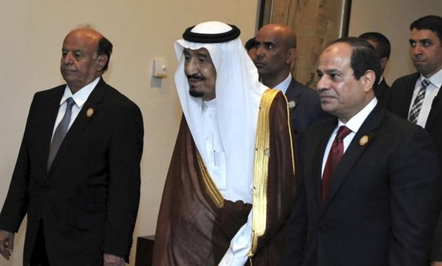 Egyptian President Abdel Fattah al-Sisi (R) stands with Saudi King Salman bin Abdulaziz al-Saud (C), and Yemen's President Abd-Rabbu Mansour Hadi during the 26th Arab Summit in Sharm al-Sheikh, in the South Sinai governorate, south of Cairo, March 28, 201