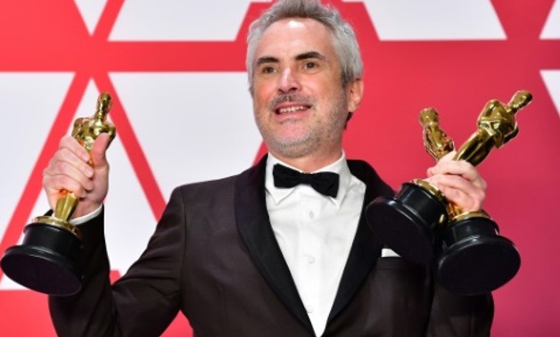 Mexican filmmaker Alfonso Cuaron is the pride of his homeland after winning three Oscars for "Roma," his ode to his childhood in Mexico City AFP
